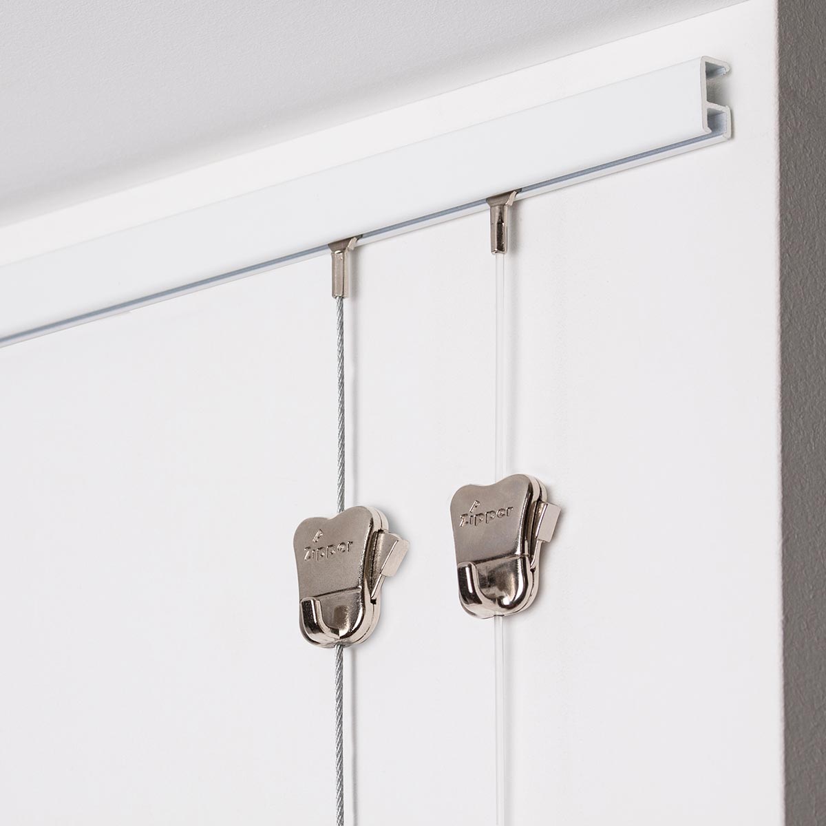 Minirail STAS: binari per quadri compatibili con ganci e cavi.