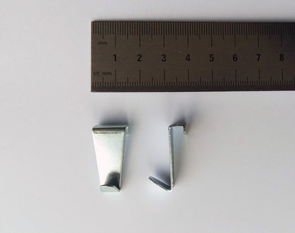 Gancio STAS per parete divisoria, design cromato raffinato.